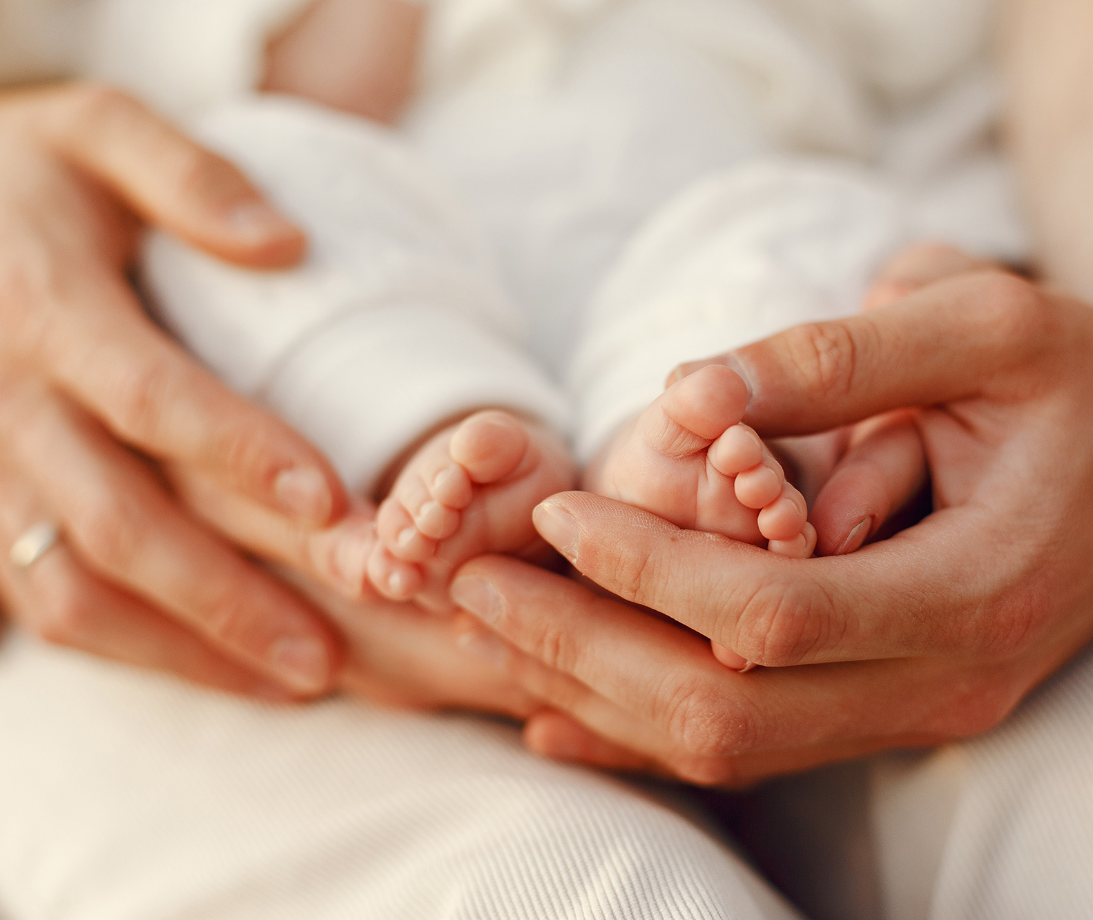 Parents with daughter. Family in a park. Newborn girl.